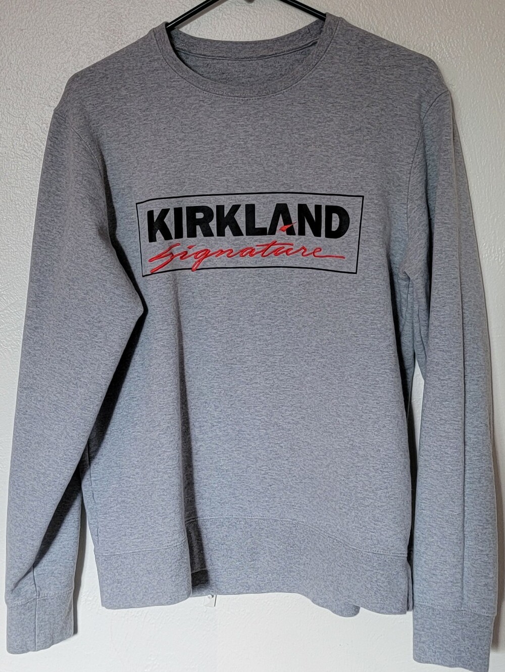 Kirkland Signature Light Gray Crewneck Sweatshirt with Black & Red Logo